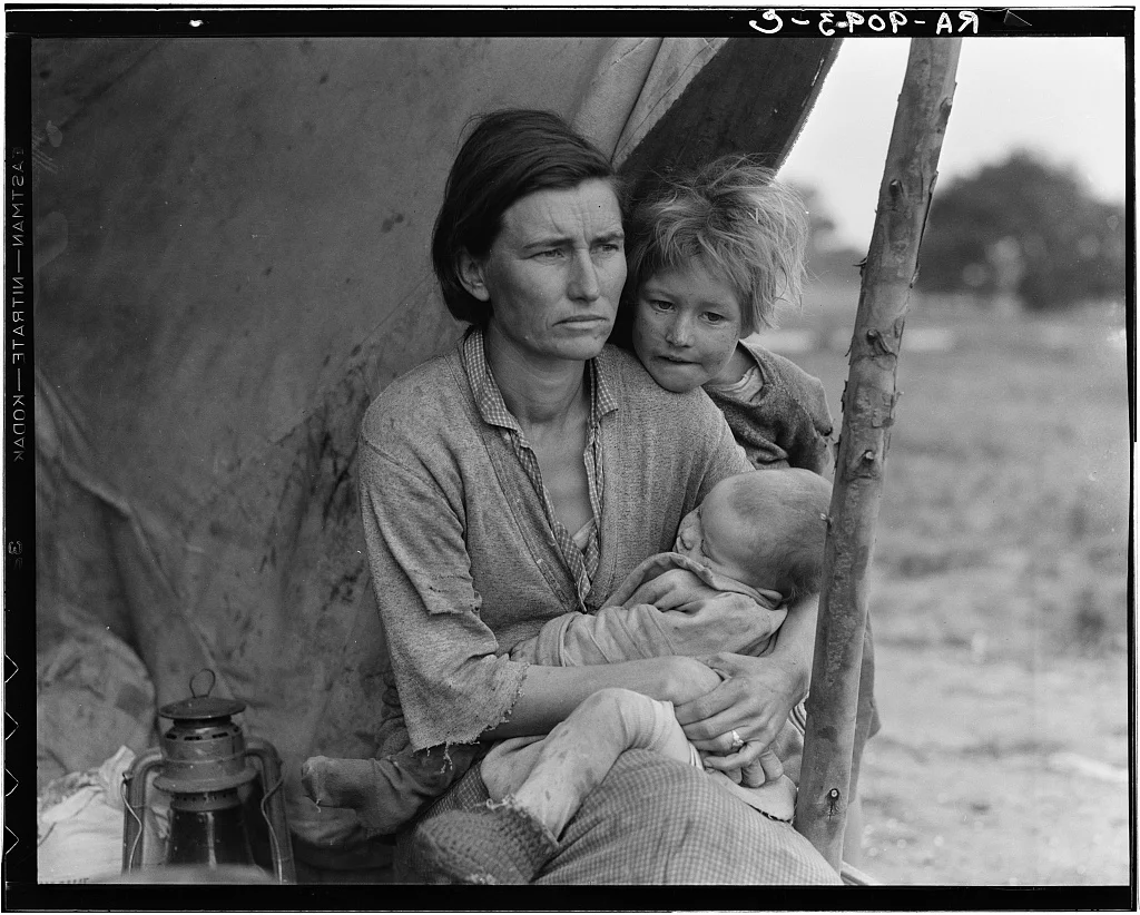A wider view of Thompson and her children beside their shelter at the Nipomo camp.