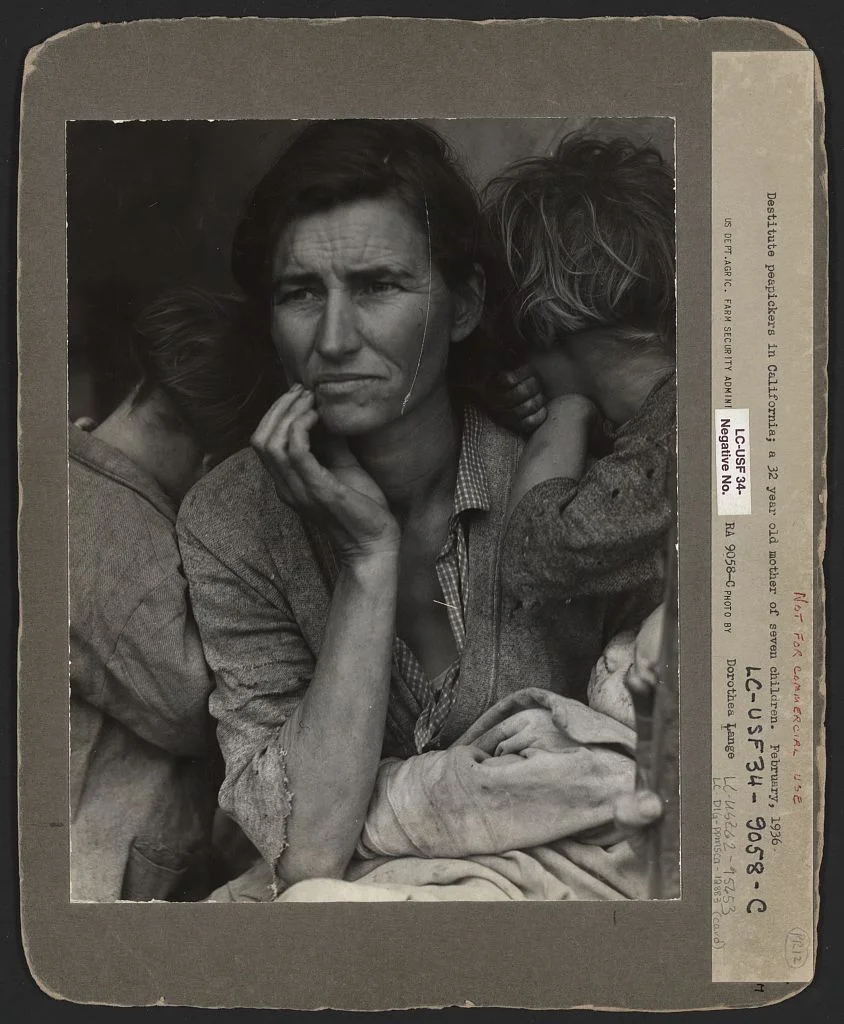 Unretouched Migrant Mother print, retaining a thumb at the lower right edge of the photograph.