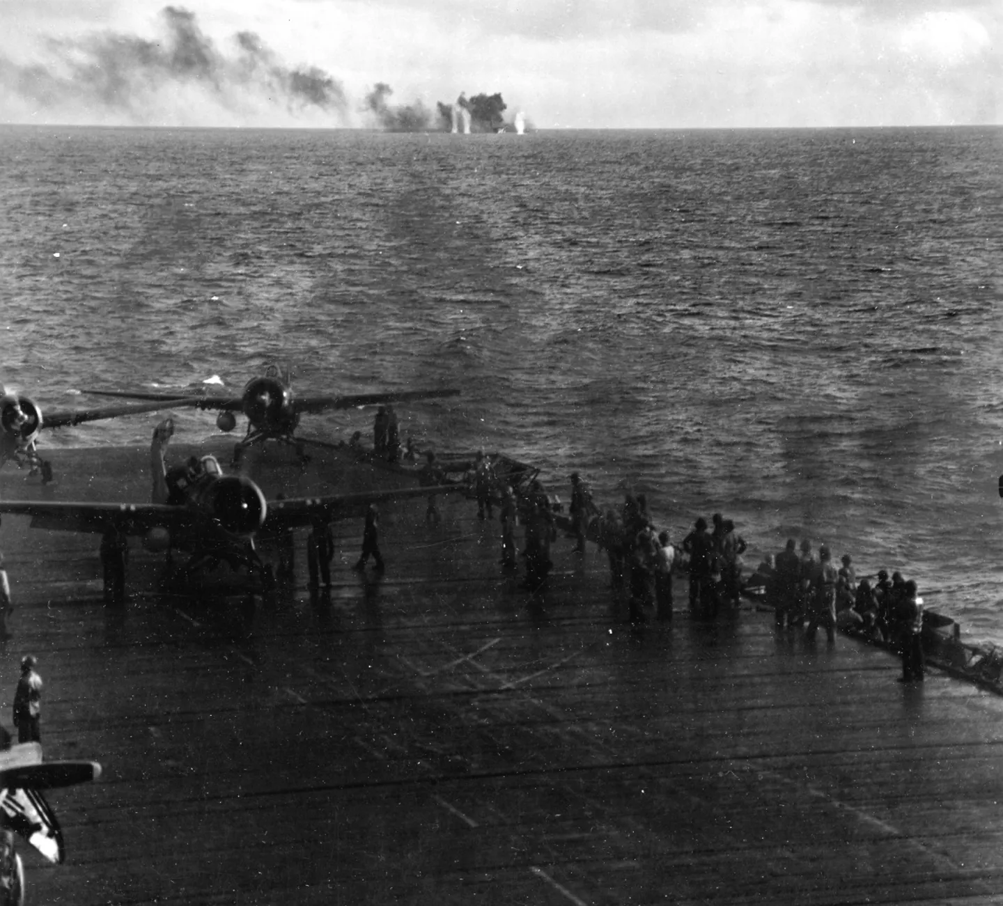 Japanese artillery shells splashing beside the U.S. escort carrier USS Fanshaw Bay during the Battle off Samar