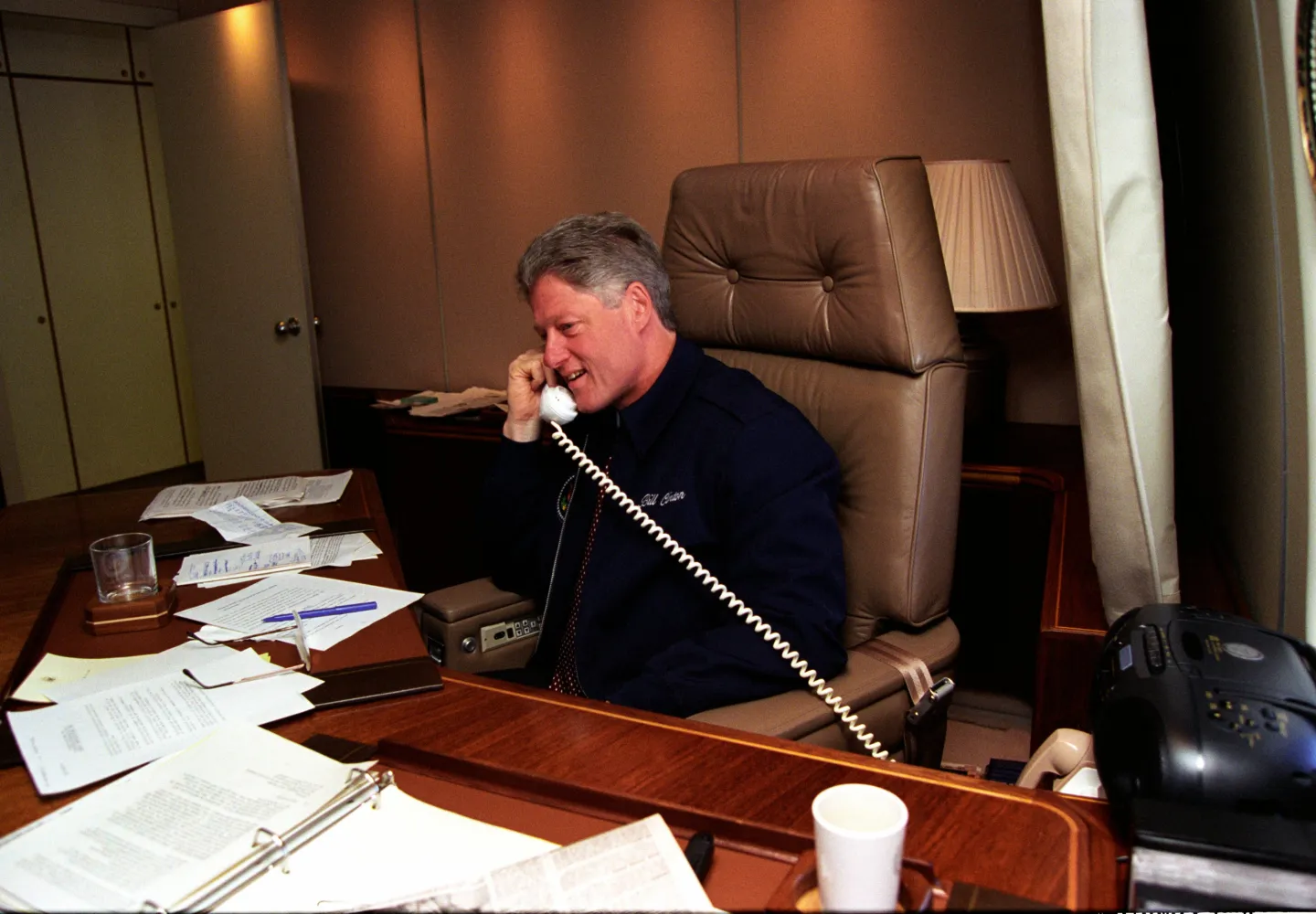 President Bill Clinton speaking with King Hussein of Jordan and Israeli Prime Minister Yitzhak Rabin aboard presidential aircraft.