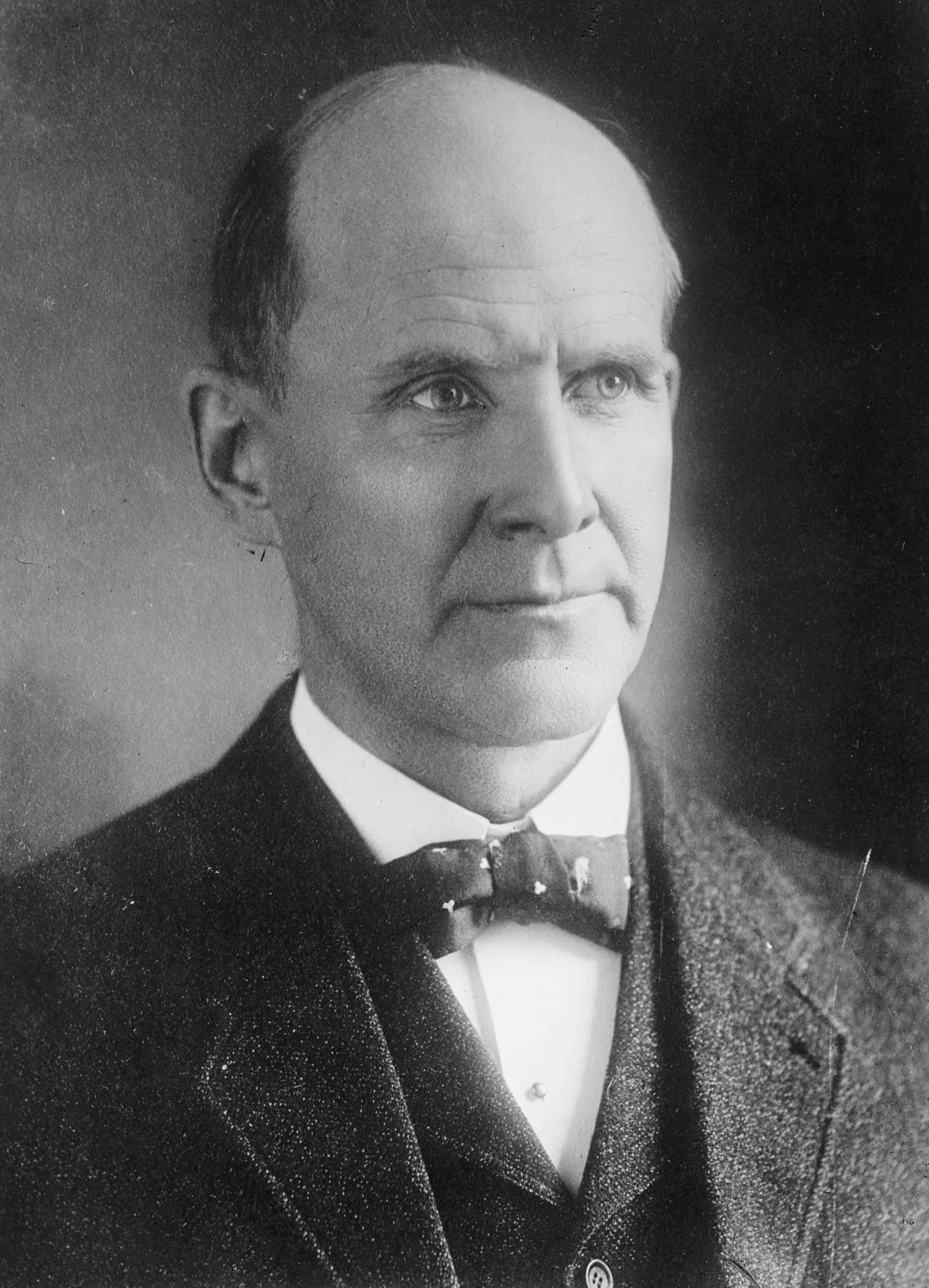 Formal portrait of Eugene V. Debs in a dark suit and bow tie.