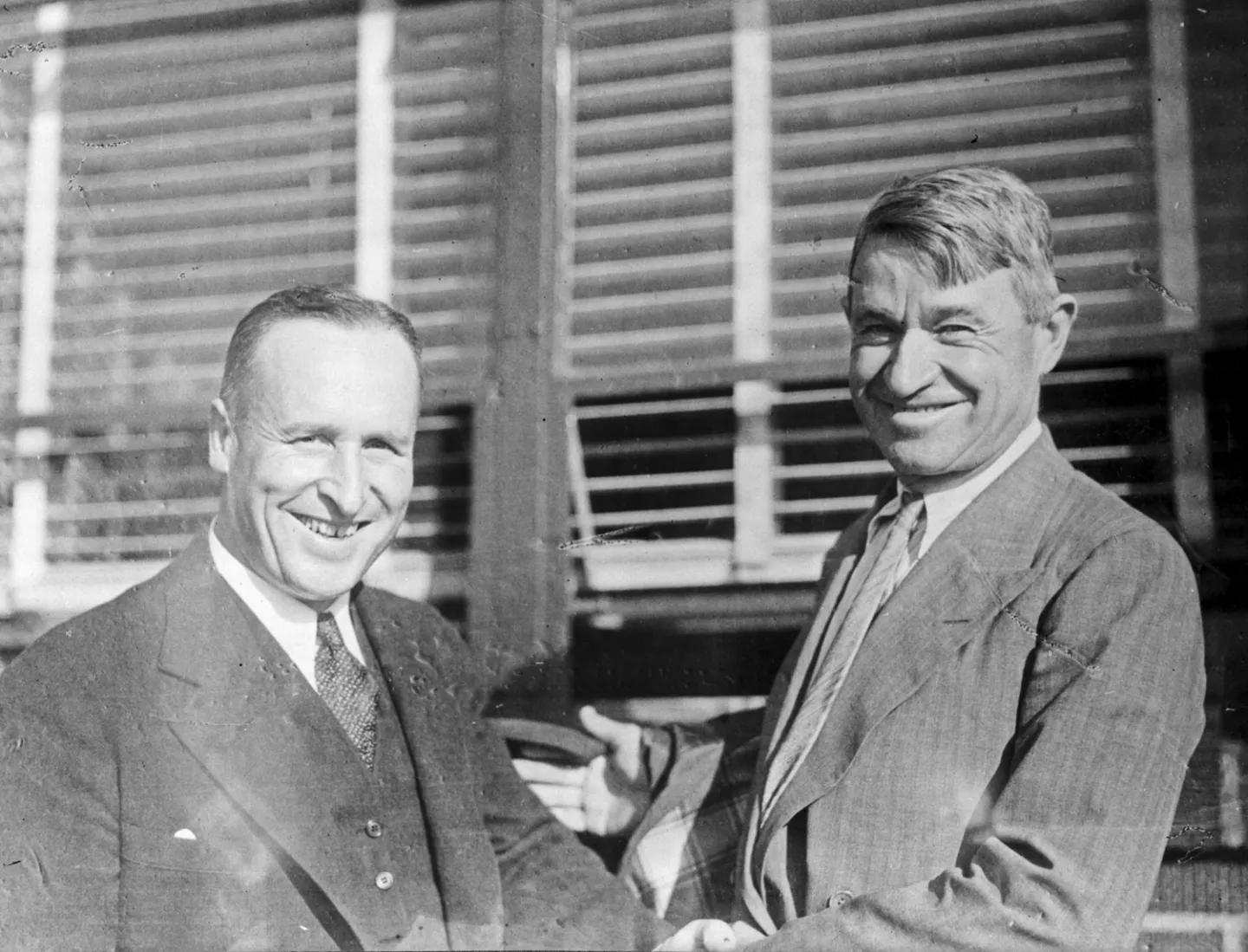 Seattle mayor Charles L. Smith shaking hands with Will Rogers.