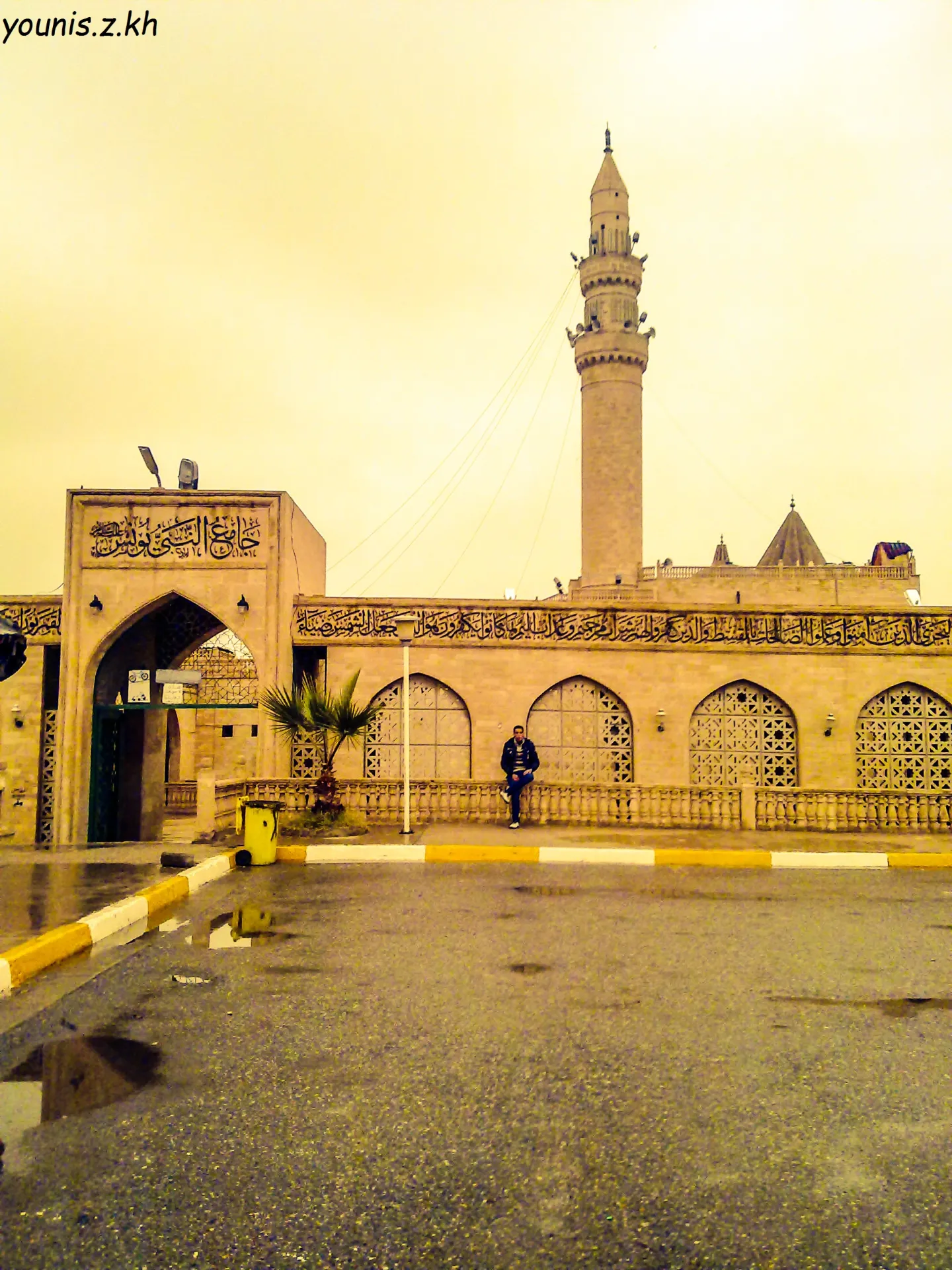 The Nabi Yunus mosque in Mosul in 2011, showing its minaret, entrance arch and decorated exterior.