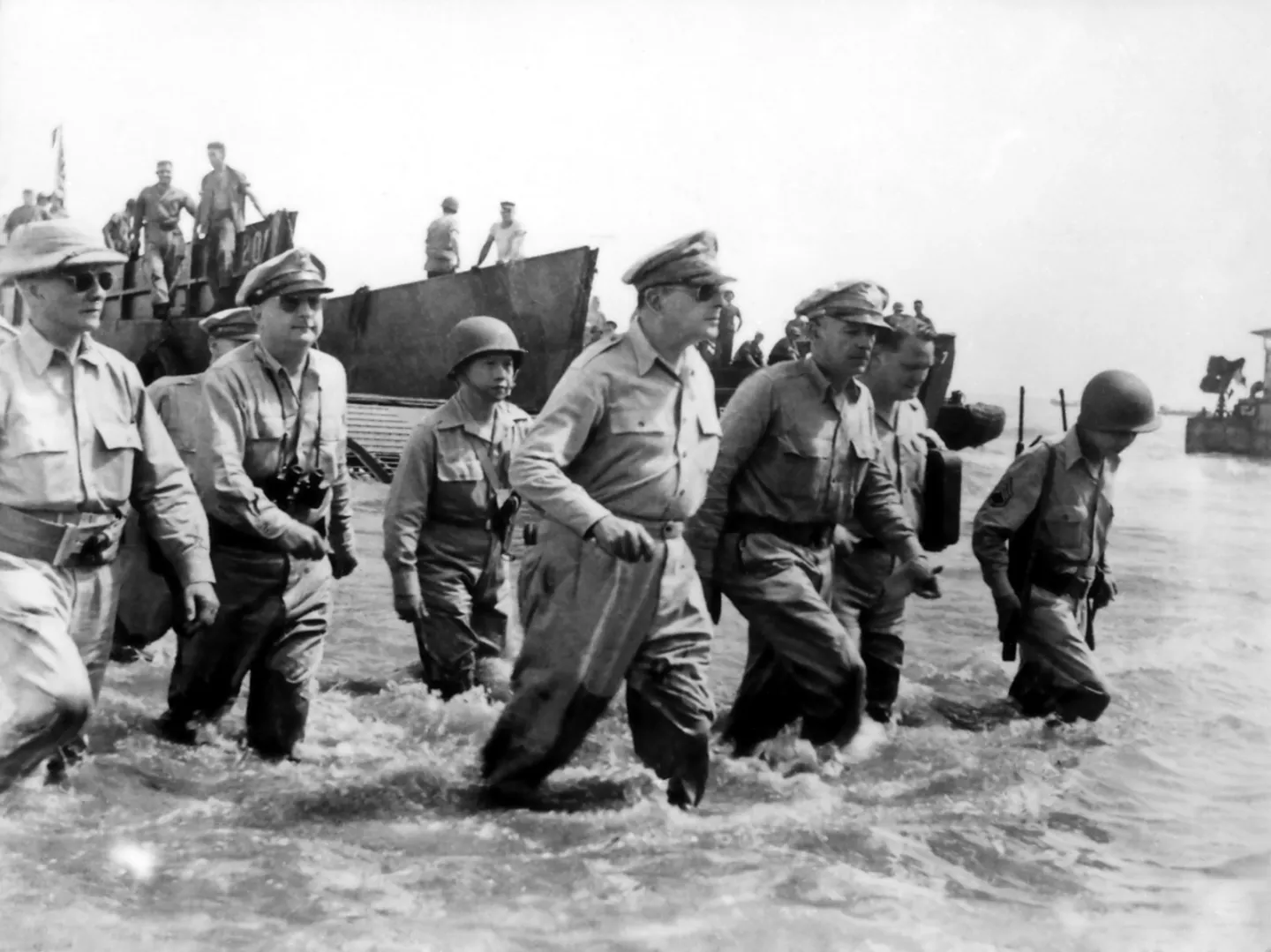 Sergio Osmeña, Douglas MacArthur and their party wading through the surf toward Leyte on October 20, 1944.