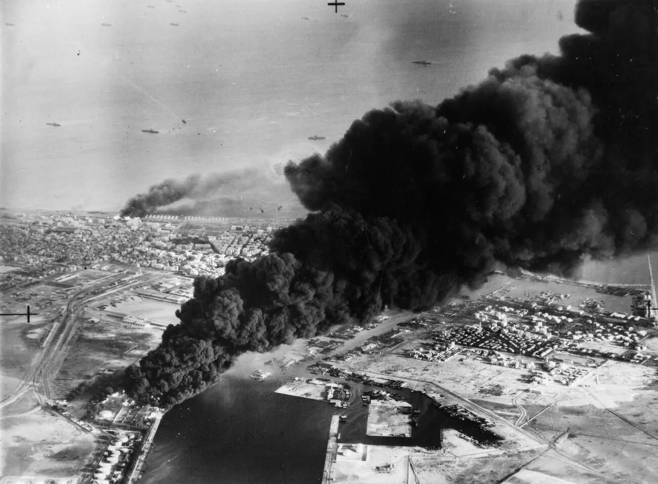 Aerial view of smoke rising from oil tanks beside the canal at Port Said.