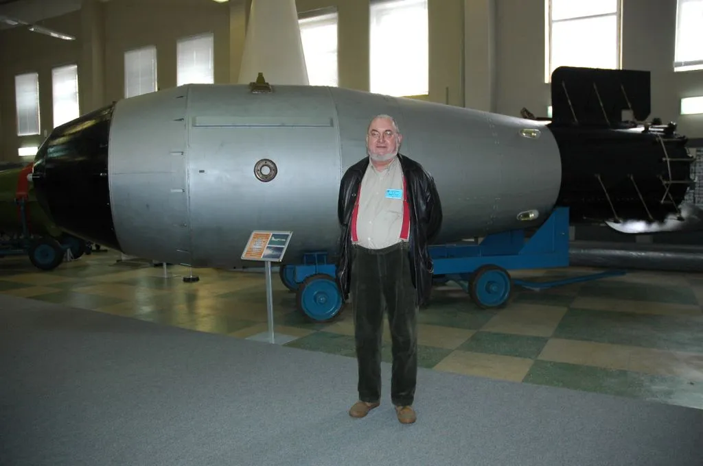 Large Tsar Bomba museum exhibit with a visitor beside it