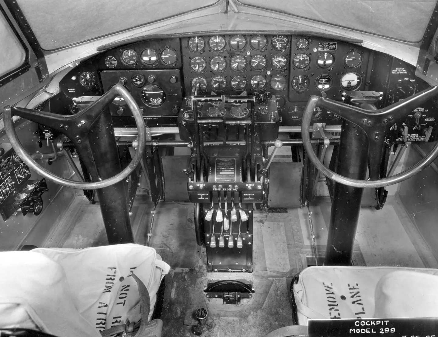 Two seats, control columns and instrument panels inside the Model 299 cockpit.
