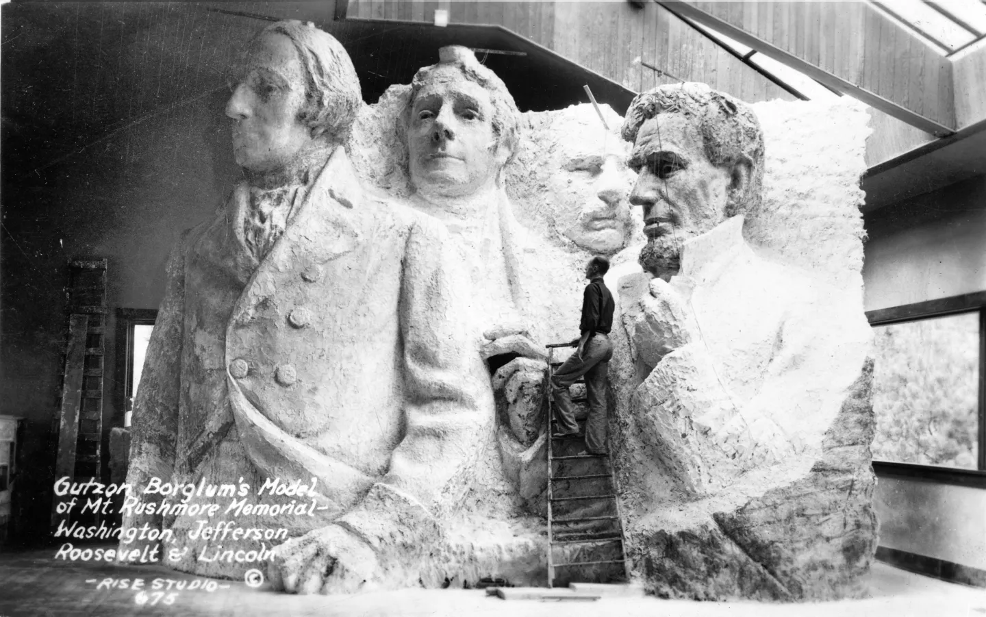Borglum’s model of four presidents with bodies extending below their heads.