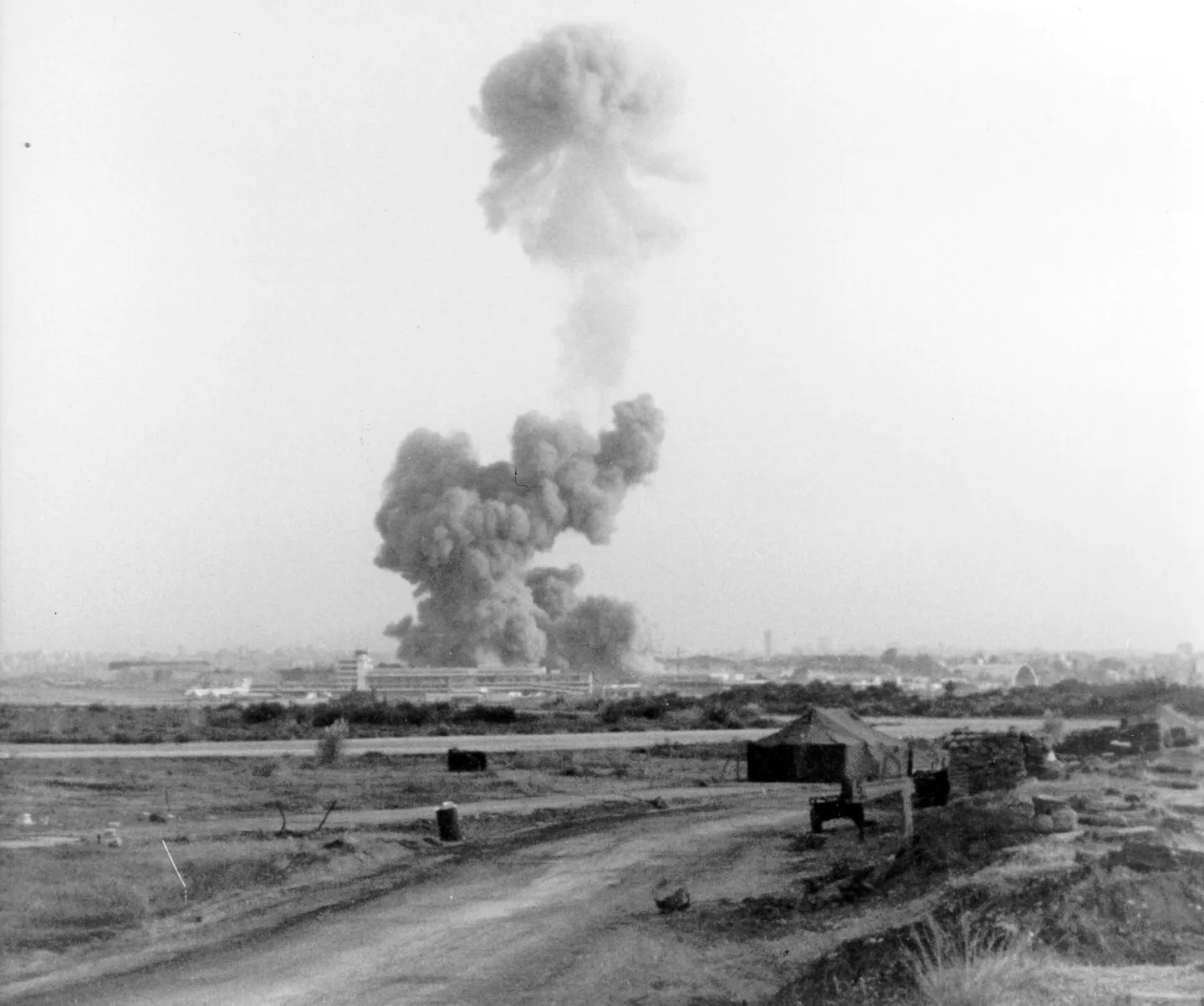 A towering smoke cloud rises over the U.S. Marine barracks complex after the Beirut bombing of October 23, 1983
