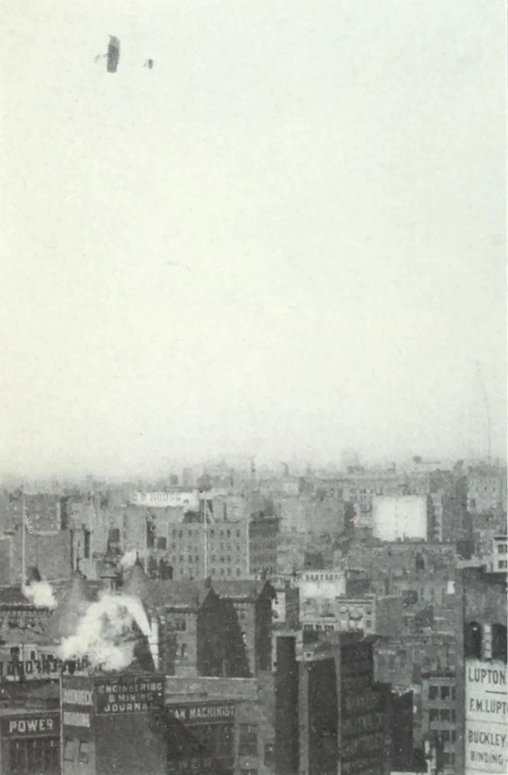 A small biplane flying high above New York buildings.