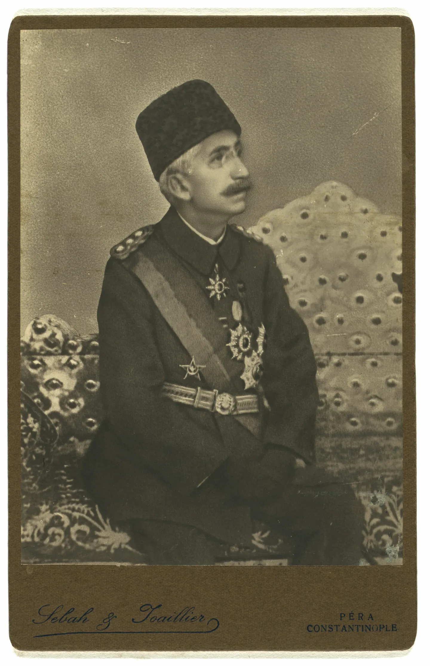 Mehmed VI seated in uniform for a formal studio portrait.