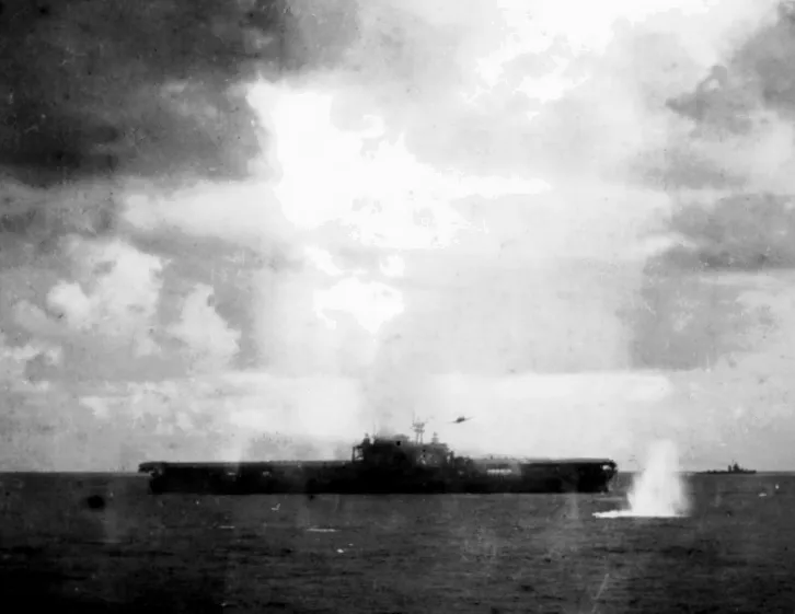 Japanese Kate torpedo aircraft dropping a torpedo alongside USS Hornet on October 26, 1942.