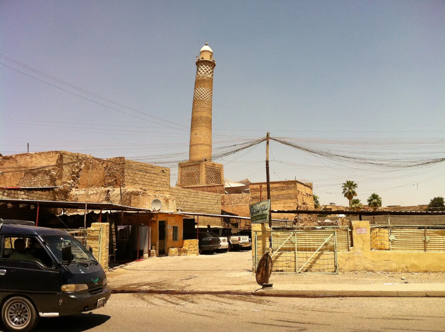 The original leaning al-Hadba minaret above street buildings in Mosul in June 2013.