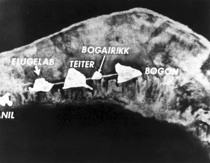 Labeled aerial photograph showing Elugelab and neighboring islands before the test.