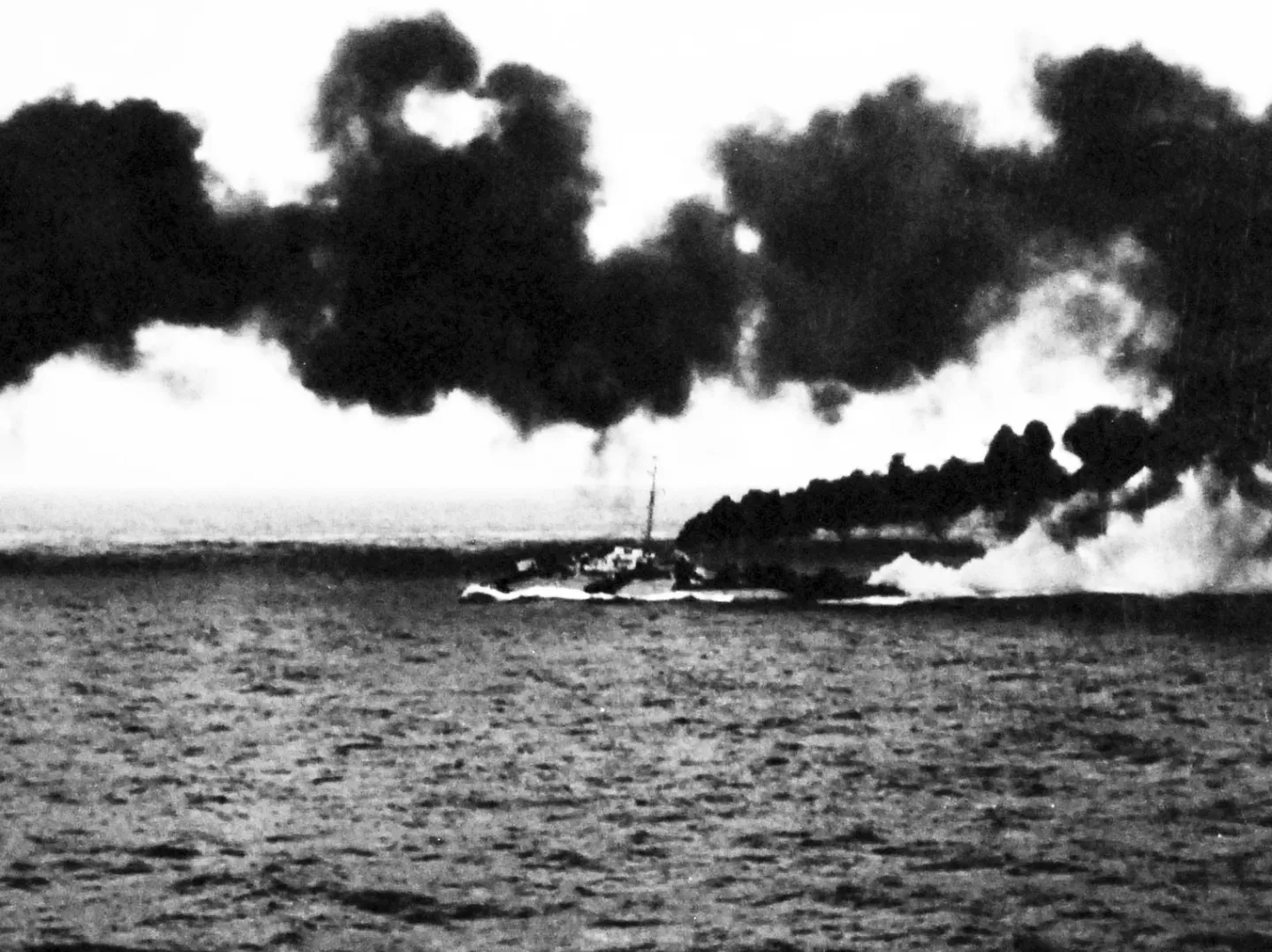 USS Dennis making a thick smoke screen over the sea during the Battle off Samar on October 25 1944
