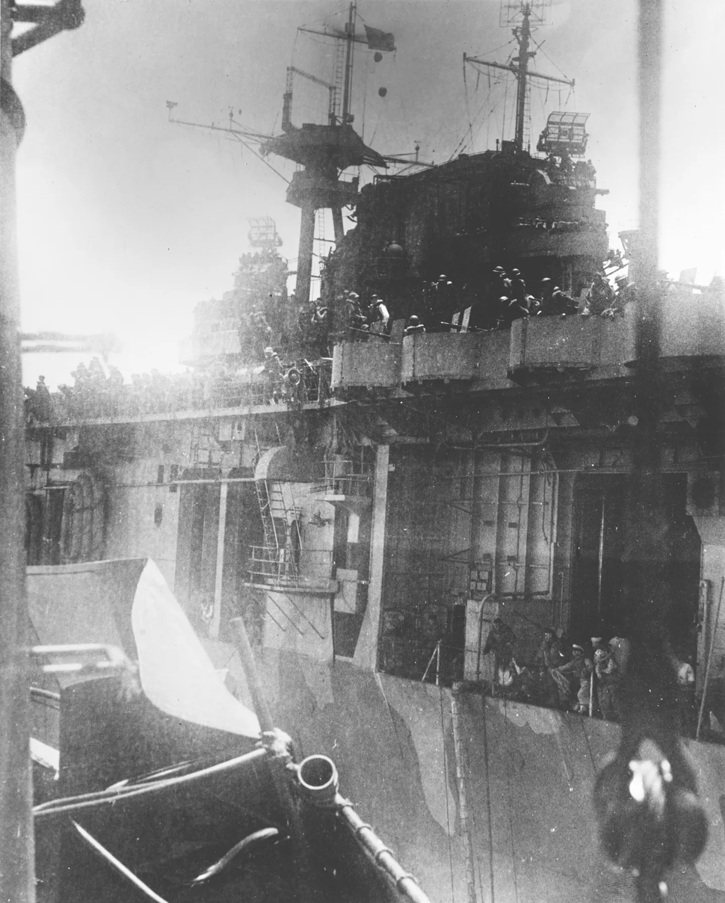 Crew members of USS Hornet prepare to abandon the damaged aircraft carrier on October 26, 1942.