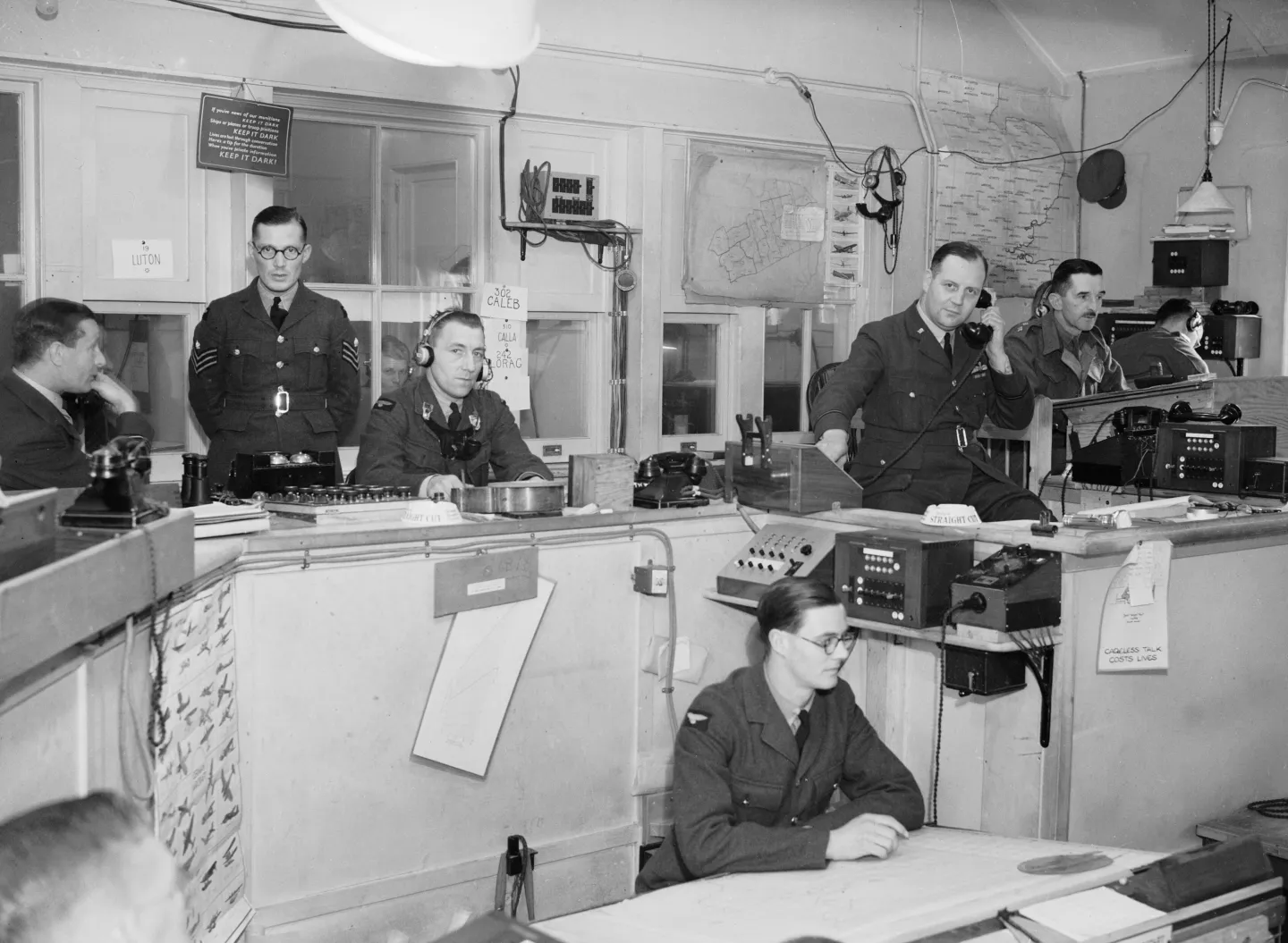 RAF officers and operators in the Sector G operations room at Duxford.
