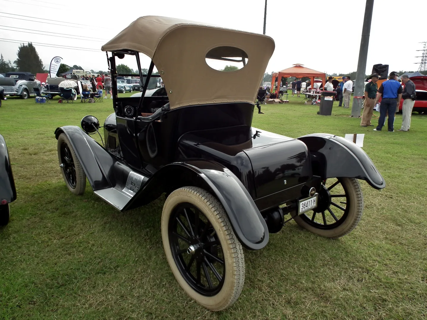 Rear three-quarter view of a preserved Chevrolet 490 runabout with its top raised.