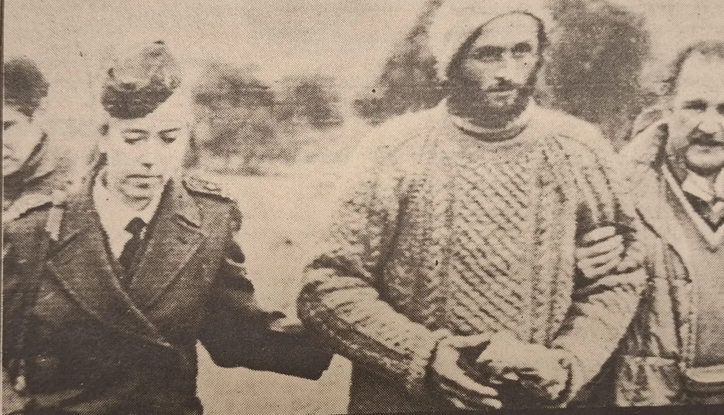 Newspaper photograph of a bearded Roberto Canessa in a thick sweater, identified by the source as the central man, standing among other men.