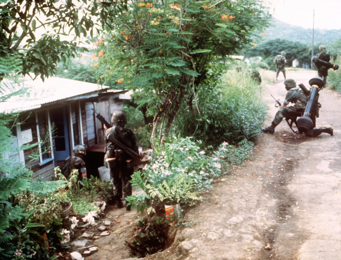 U.S. Army 82nd Airborne soldiers equipped for combat on patrol in Grenada during 1983