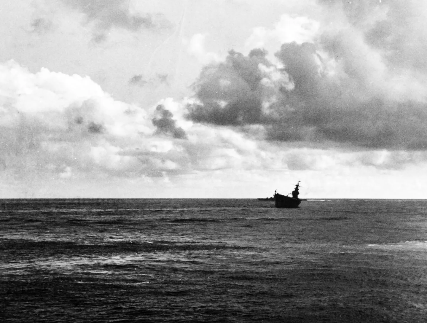 USS Hornet heavily listing after Japanese air attacks in the Battle of Santa Cruz, 26 October 1942.