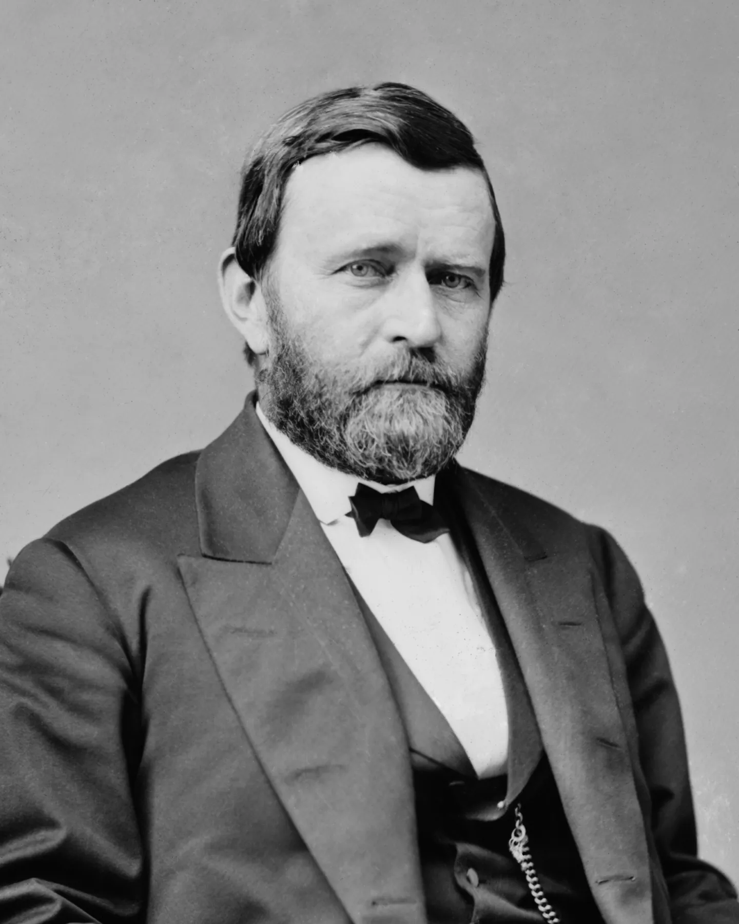 Ulysses S. Grant poses in a dark civilian suit.