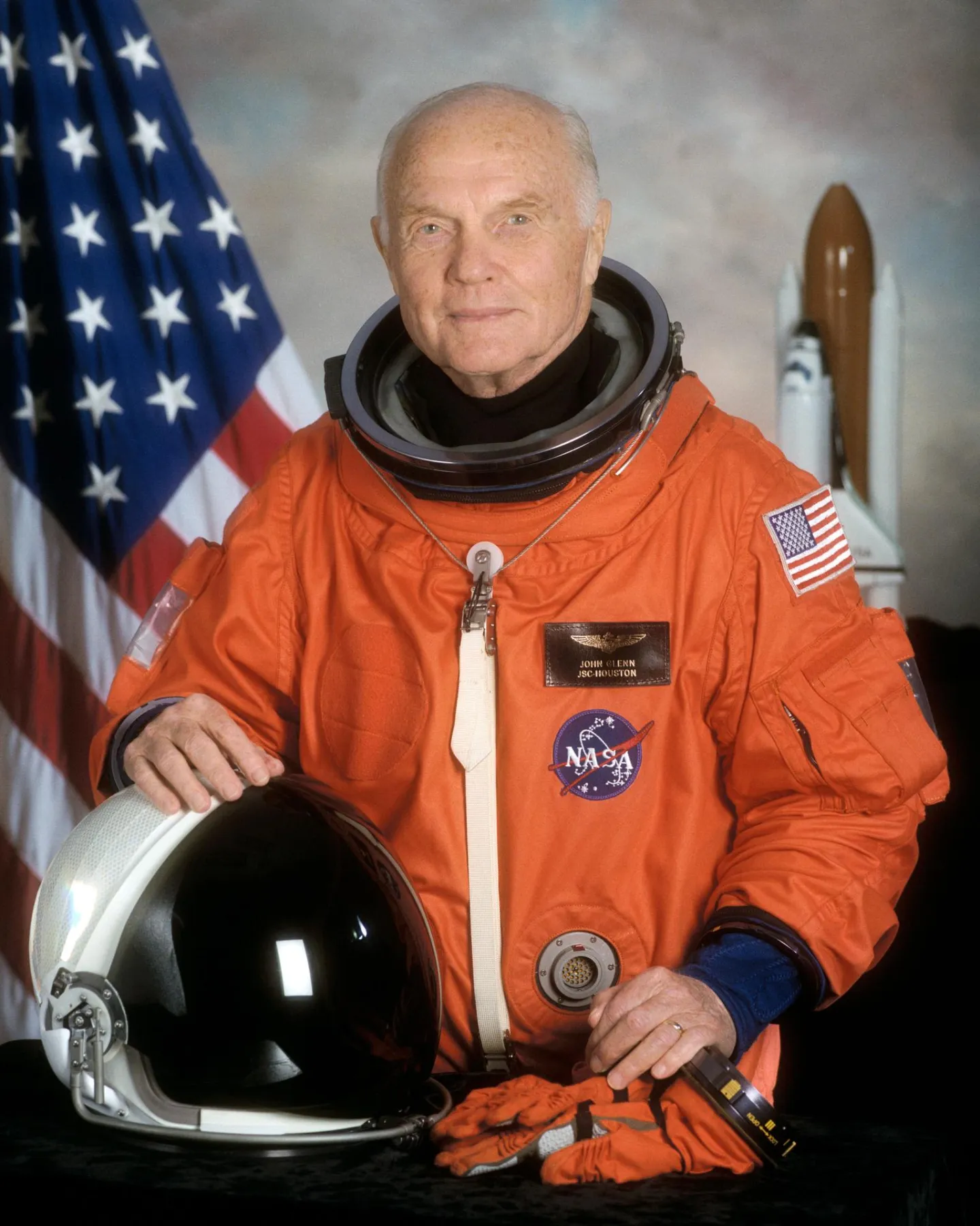 John Glenn wearing his orange STS-95 launch and entry suit.