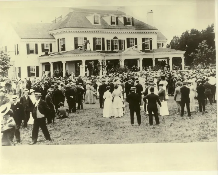 A large crowd gathered on the lawn outside a building at Sea Girt.