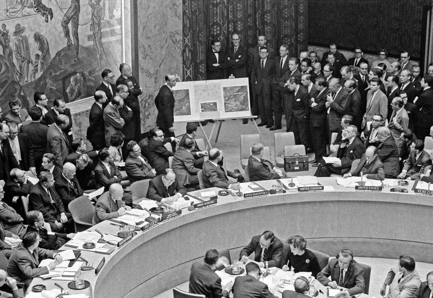 Adlai Stevenson at the United Nations Security Council, with David Parker standing beside enlarged reconnaissance photographs of Cuban missile sites.