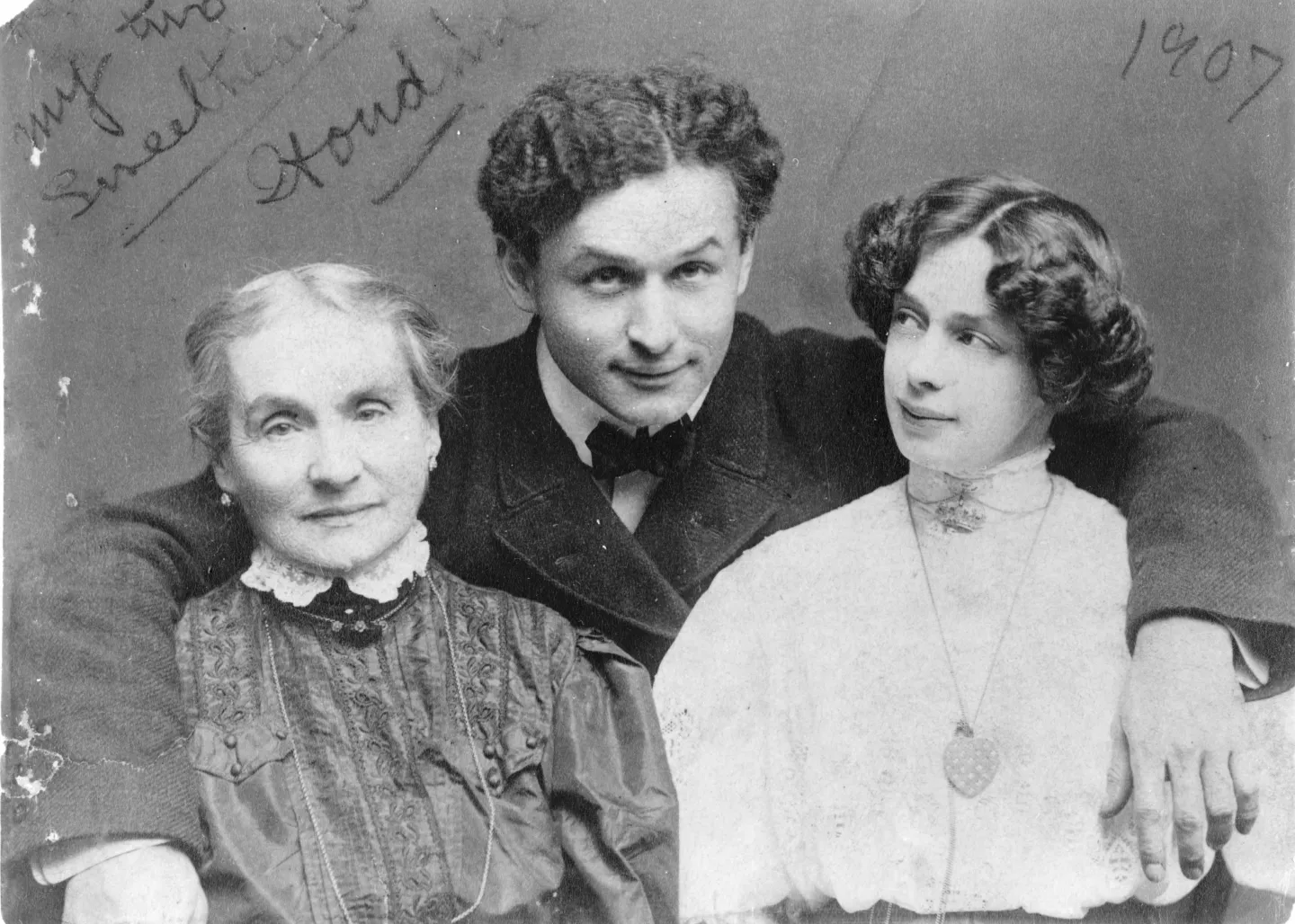 Harry Houdini poses with Beatrice Houdini and Cecilia Steiner Weiss.