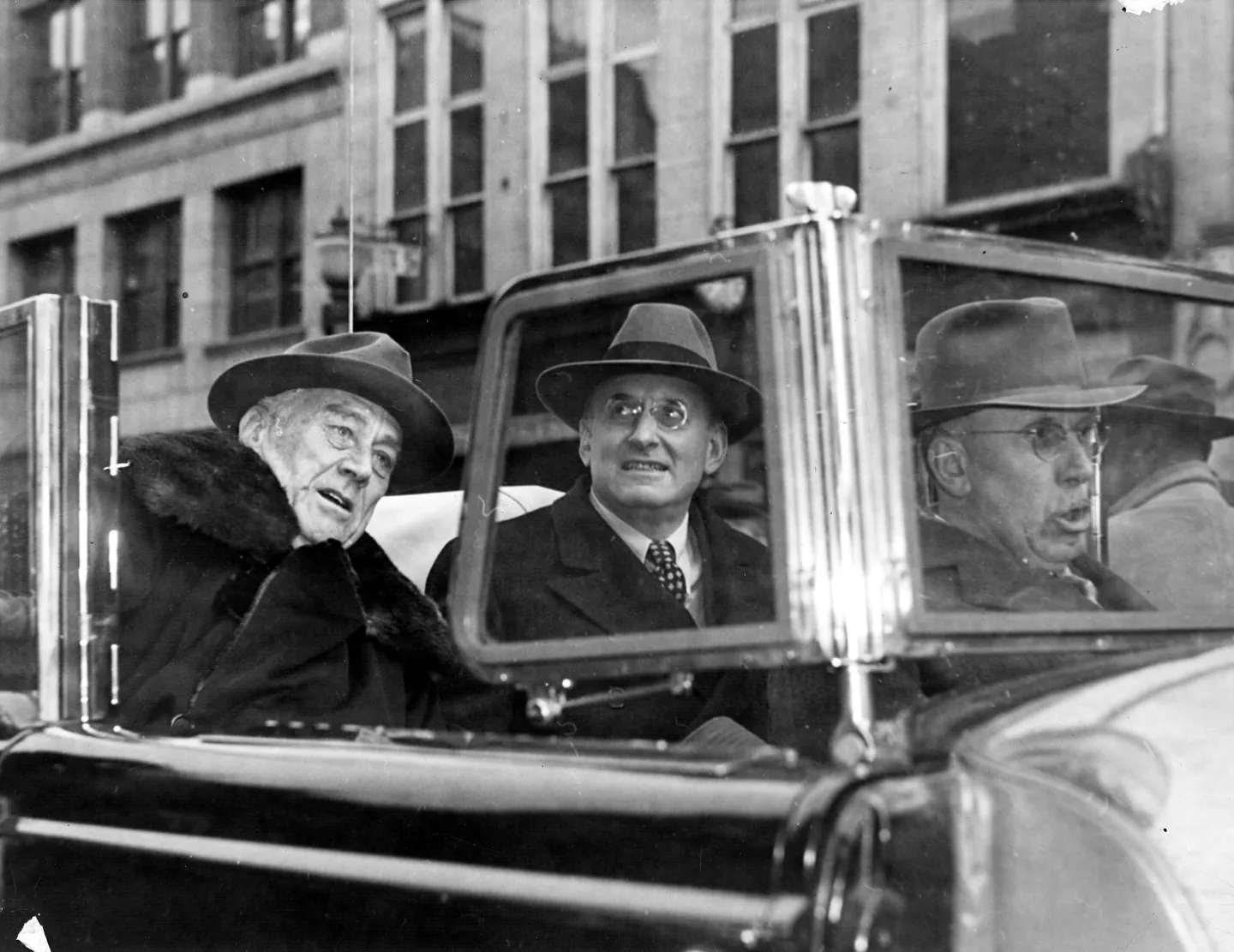 Roosevelt and Henry Morgenthau Jr. sit together in a car during a campaign appearance.