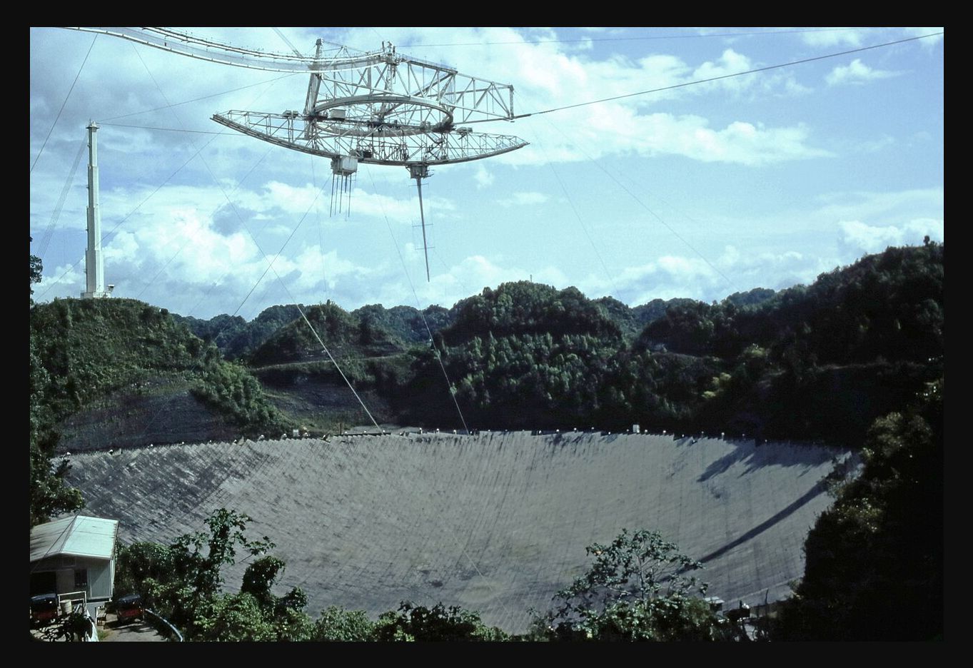 Arecibo’s reflector and suspended instrument platform photographed by Manfred Niermann in 1982